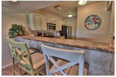 the kitchen is clean and ready to be used as a dining room or office area