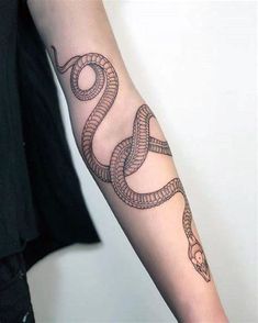 a snake tattoo on the arm