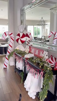 christmas decorations and candy canes are on display in the living room