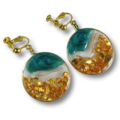 These clip-on earrings are made with dark metallic green resin and crushed gold glass! Gold Round Resin Earrings, Gold Resin Earrings, Heart Shape Pendant, Beach Inspired, Gold Glass, Beautiful Heart, Gorgeous Necklaces, Glass Pendants, Clip On Earrings