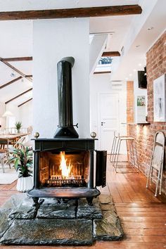 an open fire place in the middle of a room