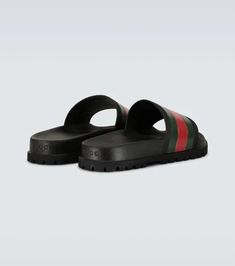 Accented with the label’s signature green and red stripes, these Gucci Web slider sandals are crafted entirely from rubber and feature a molded footbed, and track sole..Made in Italy.Designer color name: Black.Fits small to size - we recommend trying one size larger.UK sizes Green Slides With Textured Footbed, Rubber Sole Slide Sport Sandals, Green Flat Slides With Removable Insole, Green Cushioned Slip-on Slides, Green Round Toe Slides With Rubber Sole, Gucci Open Toe Leather Slides, Flat Slides With Rubber Sole, Gucci Leather Open Toe Slides, Gucci Cushioned Slide Sandals