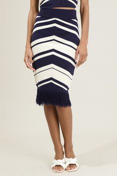 If you’re headed to dinner or day in your resort the Lydia Striped Midi Skirt will be your favorite. It features a sweater knit fabric with a fringe detail at the bottom. It has a stretchy fit and the stripped pattern make it extra cute. Add on the matching top to create a finished look! - Diagonal Pattern- Fringe detail- High waisted- Slim fit- Color: NavySize + Fit - Model is 5'8" and wearing size XS- Measurements taken from size S - Waist: 13"- Length: 22 3/4" Fabric Self: 50% Viscose, 27% Po Stripped Pattern, Striped Midi Skirt, Sweater Tank Top, Matching Top, Sweater Knit, Stripe Sweater, Sweater Skirt, Knit Fabric, Maxi Skirt