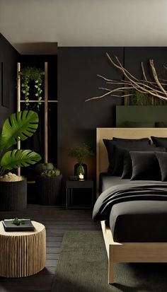 a bed with black sheets and pillows in a room next to a plant on the wall