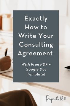 a desk with a pen and paper on it that says exactly how to write your consulting agreement