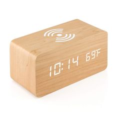 a wooden alarm clock with the time displayed on it's display screen and white numbers