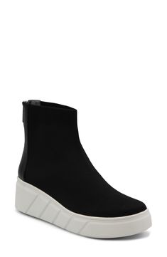 A well-cushioned footbed and stretchy knit upper bring lasting comfort to this fashion-forward sneaker kicked up on a textured platform wedge. 2" heel; 1" platform Back zip closure Cushioned footbed with arch support Textile upper/synthetic lining/rubber sole Imported Mid-top Synthetic Platform Wedge Sneakers, Modern Synthetic Platform Sneakers With Thick Bottom, Modern Black Platform Wedge Sneakers, Modern Wedge Sneakers With Lug Sole, Mid-top Platform Wedge Sneakers With White Sole, Black Synthetic Wedge Sneakers With Thick Bottom, Mid-top White Sole Platform Wedge Sneakers, Wedge Sneakers With Lug Sole And Round Toe, Modern Platform Sneakers With Wedge Heel