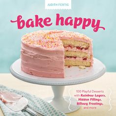 a magazine cover with a pink cake on the front and bottom page, featuring an advertisement for bake happy