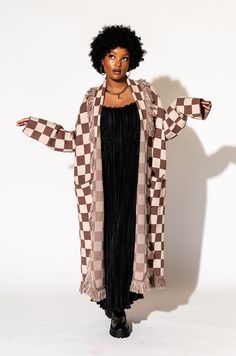 Lala Original Designs are thoughtfully designed in-house. These clothes were made for you. - Luxurious oversized blanket cardigan- Checker pattern in shades of tan- Fringe all down the collar & hem- Stretchy, thick, plush knit- Ultra soft material- Duster length Sabrina is 5'7", typically wears a size 2, and is wearing a S/M. Sierra is 5'8", typically wears a size 8 and is wearing a S/M.50% viscose 30% polyester 20% nylon © Dressed in LALA™ 2024 // Design owned and created by Dressed in LALA™ Oversized Beige Shawl Collar Outerwear, Oversized Brown Cardigan For Loungewear, Brown Long Outerwear For Loungewear, Long Brown Outerwear For Loungewear, Brown Long Sleeve Outerwear, One Size, Brown Long Sleeve Outerwear One Size, Oversized Open Front Brown Sweater, Oversized Brown Open Front Sweater, Oversized Brown Outerwear For Loungewear