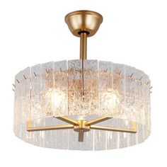 a chandelier hanging from a ceiling fixture with glass shades on the top and bottom