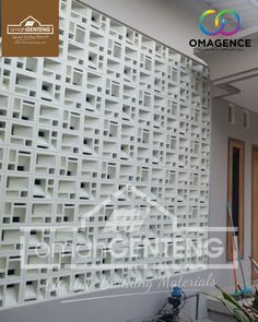 an image of a wall made out of white plastic bricks and wood doors with the words omagence on it