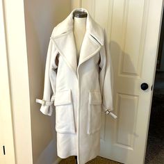 Beautiful Gucci Wool Cream Coat. Large Fashion Lapels. Very Warm And Thick. Beautiful Accent, Including Gold Hardware Branded With Gucci Accents And Front Pockets. Perfect For Winter. New Without Tags. However, One Small Moth Hole Noted In Pictures On Left Shoulder. Can’t See When Wearing Due To The Lapel Covering It. Size: 42 (Italy) Size: 6 (Usa) Shoulder To Shoulder - 19” Collar To Hem - 43” Shoulder To Sleeve - 26” Luxury Gucci Cream Outerwear, Luxury Cream Gucci Outerwear, Gucci Long Sleeve Cream Outerwear, Gucci Cream Long Sleeve Outerwear, Gucci Cream Winter Outerwear, Fitted White Gucci Outerwear, White Gucci Outerwear For Work, Beige Gucci Outerwear For Winter, White Gucci Outerwear For Spring