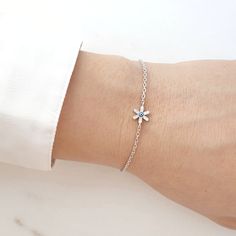 ♢ STYLE Subtle Flower Zirconia and Enamel Greek evil eye bracelet crafted from 925 Sterling Silver. Instantly brings a luxe touch to your everyday casual style. ♢ FEATURES & MATERIALS  :: Made of 925 Sterling Silver :: White Cubic Zirconia :: Dark Blue Enamel :: Chain made of 925 Sterling Silver :: Spring ring clasp made of 925 Sterling Silver ♢ SIZE & FIT :: Bracelet length adjustable from 15.50cm ( 6.10" ) to 18cm (7") :: The evil eye size is 7.70 mm(0.30") x 7.70mm(0.30") ♢ DELIVERY  :: This Flower-shaped Cubic Zirconia Bracelets As Gift, Delicate Sterling Silver Flower Bracelets, Delicate Sterling Silver Flower Bracelet, Delicate Flower-shaped Sterling Silver Bracelets, Dainty Silver Flower Bracelets, Dainty White Gold Flower Bracelet, Delicate Silver Bracelets With Flower Charm, Delicate Silver Bracelet With Flower Charm, Dainty Silver Flower Charm Bracelet