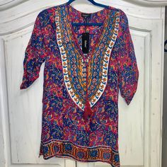 Brand New With Tag From Tolani. Bought At Revolve Clothing. Silk Boho Style Dress With Mandala On Back. Xs. Style Is Madison. Vibrant Print V-neck Tunic, Purple Floral Print Tunic Dress, Purple Boho Dress With Floral Print For Vacation, Bohemian Purple Tunic Dress, Purple Bohemian Tunic Dress, Printed V-neck Festival Tunic, Festival V-neck Printed Tunic, Purple Tunic Dress For Beach Cover-up, Purple Boho Print Dress For Festivals