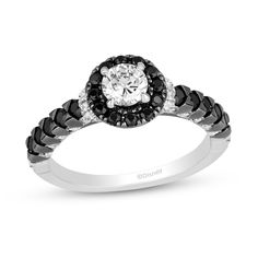 an engagement ring with black and white diamonds