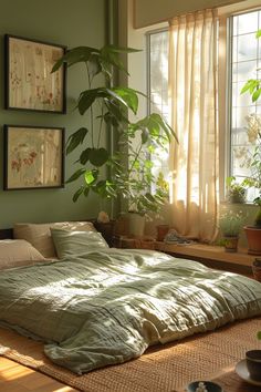 a bed sitting under a window next to a plant in a potted planter