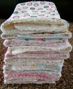 a stack of towels sitting on top of a carpet