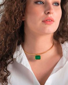 This exquisite Gold Collar Choker Necklace with Big Charm Green Emerald Quartz Stone will add structure to the romantic and bohemian outfits. It is a perfect balance of tribal torque necklace and modern city minimalist piece that increases the fashion temperature of an outfit. It is a jewellery piece that will elevate the outfit and will make you feel absolutely confident and irresistible: whether is avant garde office attire or festival summer dress.  Pendant size:  10mm x 0.7mm  Collar total l Torque Necklace, Emerald Quartz, Bohemian Outfits, Emerald Green Stone, Collar Choker, Festival Summer, Statement Choker, Gold Collar, Gold Choker Necklace