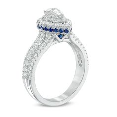 a diamond and blue sapphire engagement ring