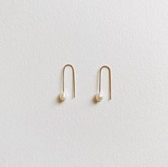 + PEARL U HOOP THREADER EARRINGS +Tiny Fresh Water pearl threader in U shape made with 14k Gold-filled wires. A small drop dangle on your ears that are modern & classic. + Fresh water pearls 4mm+ 14k Gold-filled wire+ Listing is for 1 pair of earrings+ Please allow 5-7 business days to ship out. Minimalist Pearl Earrings For Everyday, Minimalist Everyday Pearl Earrings, Everyday 14k Gold Filled Pearl Earrings With Ear Wire, Adjustable Minimalist Threader Earrings For Everyday, Minimalist White Pearl Earrings In 14k Gold Filled, Minimalist White Pearl Earrings 14k Gold Filled, Minimalist 14k Gold Pearl Drop Earrings, Minimalist White 14k Gold Filled Pearl Earrings, Minimalist Pearl Drop Threader Earrings