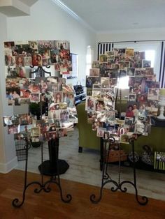 there are many pictures on the wall in this living room and it looks like they have been made out of photos