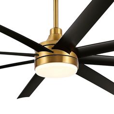 a gold ceiling fan with black blades and a white light on the top of it