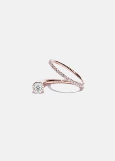 —The Crescendo Collection A harmony of tapering lines and floating diamonds. Crafted of polished 18 karat gold, our Diamond Crescendo Flare Ring wraps around the finger and showcases a sparkling 0.40carat diamond with a sideways diamond pavé band. 1.10tcw / 5.94 grams Diamond Grade: F/G color, VS clarity Quarter sizes are available upon request. Please make a note at checkout. Custom variations can be done with alternative stone color and sizes. For inquires: bespoke@katkimfinejewelry.com Availa Dazzling Open Rose Gold Diamond Ring, Dazzling Rose Gold Open Diamond Ring, Fine Jewelry Single Diamond Ring For Everyday Luxury, Elegant Rose Gold Bypass Ring With Diamond Accents, Rose Gold Diamond Ring With Accents For Everyday Luxury, Rose Gold Diamond Bypass Ring With Diamond Accents, Rose Gold Bypass Ring With Diamond Accents, Rose Gold Diamond Bypass Ring With Brilliant Cut, Everyday Luxury Rose Gold Diamond Ring