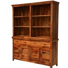 an old wooden cabinet with drawers and doors