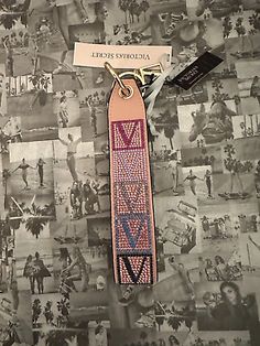 a pink lanyard with the words virginia on it and pictures of people in black and white