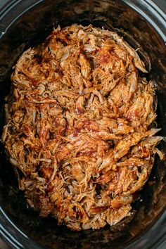 shredded meat in the slow cooker is ready to be cooked