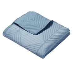 the blue blanket is folded up on top of a white background and it has a diamond pattern