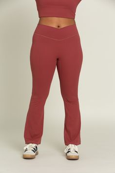 Feel effortlessly on trend for your workout class or a day on-the-go with our Pale Red Flare Yoga Pants. The crossover waistband provides an elevated look, offering you both security and comfort for any activity. The flare leg creates an unrestricted yet chic design. Pair with our Pale Red Square Neck Long Sleeve Top for the perfect set. Moisture-wicking Wide Leg Activewear For Sports, 4-way Stretch Wide Leg Activewear For Workout, Moisture-wicking Wide Leg Yoga Pants For Gym, Red Fitted Sweatpants For Athleisure, Red Athleisure Sweatpants For Gym, Red Stretch Sweatpants, Athleisure Red Sweatpants For Gym, Comfort Stretch Wide Leg Activewear For Sports, Red Stretch Sweatpants Sportswear