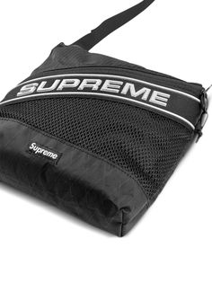 Find SUPREME Logo Shoulder Bag on Editorialist. The Supreme Logo Shoulder Bag is crafted from black ripstop texture canvas with mesh panelling. It features a panelled design, single flat top handle, adjustable shoulder strap, appliqué logo, signature box logo, front zip-fastening pocket, slip pocket to the rear, main compartment, internal zip-fastening pocket, and top zip fastening. Supreme Logo, Texture Canvas, Box Logo, The Supreme, Flats Top, Canvas Texture, Top Handle, Shoulder Strap, Mesh