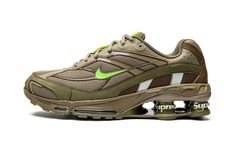 The Supreme x Nike Shox Ride 2 “Neutral Olive” is one of multiple colorways of the retro performance running shoe co-designed by the “World Famous” streetwear brand its Spring/Summer 2022 collection.  The Nike Shox Ride 2 originally debuted back in 2004 before returning in several new colors for Supreme’s 2022 collaboration.  This colorway features a tan mesh upper with overlays designed in olive green and brown leather and nubuck.  In true Supreme fashion, the brand places its signature brandin Mens Nike Shox, Supreme Shoes, Electric Green, Latest Shoe Trends, Green Sneakers, Nike Shox, Stadium Goods, Nike Green, Dior Shoes