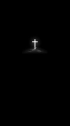 the cross is lit up in the dark