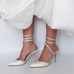 Our elegant pumps are framed by crystal-encrusted anklets. Crafted in Greece, they're made from soft pearl-white leather and set on comfy stiletto heels. The elegant pointed toes have a leg-lengthening effect. ♥ Colour: Pearl-ivory ♥ Heel height: 9.5 cm (3.74 in) ♥ Sizing: Fits true to size, take your normal size ♥ If you need a rush delivery please let us know. ♥ Returns: The item(s) can be returned for refund within 10 days of the order's delivery date. In order for returns to be accepted, all items must be in perfect condition with security tag, original packaging and original invoice. In this case, you shall solely bear the immediate cost of returning the product. ♥ Please add your phone number in your order details. It will be needed for delivery courier. Thank you! We create high qua Wedding Shoes With Rhinestones And Ankle Strap For Gala, Ankle Strap Wedding Shoes With Rhinestones For Gala, Gala Wedding Shoes With Rhinestones And Ankle Strap, Silver Ankle Strap Wedding Shoes With Crystals, Elegant Champagne Wedding Shoes With Ankle Strap, Champagne Ankle Strap Wedding Shoes With Rhinestones, Champagne Ankle Strap Wedding Shoes For Gala, Elegant Rhinestone Wedding Shoes For Reception, Elegant Rhinestone Wedding Shoes