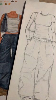 a drawing of a woman's top and pants next to a piece of paper