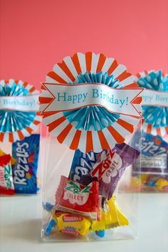 three bags filled with candy on top of a table