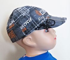 "This Child baseball hat is made of 100 percent cotton it is reversible with accommodating  color combination that will complement with each other. The outside color is solid dark grey with motorcycle printed design and the reverse fabric is solid ligh grey with world travel print with printed design appropriate for children or infant. This bonnet came in size of newborn, small, medium, large and extra large.: Extra Small ( 17\" 3-6 Mos) Small ( 18.5\" 6-12 mos), Medium ( 19\" 2T-3T), Large ( 19.5\" 3T-4T) Extra large ( 20\" 4-5 size). They are handmade double stitch, pre-soak to prevent from shrinking more, it also machine washable and dry it in delicate cool cycle. All items are shipped within 1 - 3 days after order received. If you require express shipment, please e-mail me \"before\" p Reversible 5-panel Hat One Size Fits Most, Reversible 5-panel Hat One Size, Reversible 5-panel Hats, Reversible One Size Fits Most 5-panel Hat, Reversible Cap Hat, Reversible Cap One Size Fits Most, Reversible Cotton Hat One Size, Cotton Brimmed Baseball Cap For Outdoor, Sports Cotton Bucket Hat