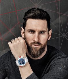 a man with a beard wearing a watch