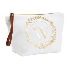 a white and gold cosmetic bag with the letter w on it's front side