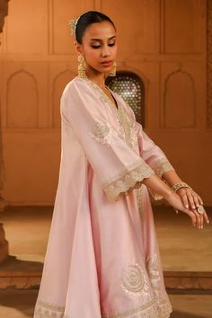 Blush pink short anarkali, adorned with kashmiri tilla, parsi gara embroidery and highlighted with basra moti. Paired with a dogri salwar and embroidered border dupatta. - Aza Fashions Traditional Drape Pink Palazzo Set With Dabka, Pink Straight Kurta Churidar For Wedding, Bollywood Style Pink Salwar Kameez For Reception, Wedding Pink Churidar With Straight Kurta, Pink Wedding Churidar With Straight Kurta, Pink Semi-stitched Kurta For Wedding, Festive Pink Wedding Kurta, Pink Zari Work Anarkali Set For Eid, Pink Anarkali Palazzo Set With Dabka