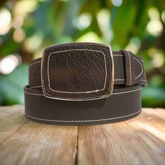 Make a bold statement with this genuine leather belt, a must-have for any wardrobe. Its  Western-inspired design will add versatility to your style, perfectly complementing your favorite blue jeans or boho dresses. Each piece is handmade for an authentic touch, and features a metal buckle and snap closure for easy removal. Elevate your fashion game with this timeless accessory. 🌻Width: 40 mm   🌻Buckle: Metal 🌻Cowhide leather belt.   Color: Dark brown JEANS SIZES ARE DIFFERENT FROM BELT SIZES Vestidos Boho, Belt For Jeans, Dresses Handmade, Handmade Leather Belt, Western Belt, Belt For Women, Boho Dresses, Casual Belt, Brown Leather Belt