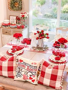 the table is set for valentine's day with red and white decor