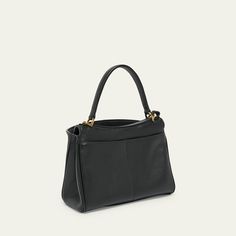 Balenciaga "Le Cagole" crossbody bag in leather  Top handle with keyring tag  Detachable, adjustable crossbody strap Can be worn as a top handle or crossbody bag  Open top with turn-lock closure  Exterior, two back slip pockets  Divided interior  Approx. 3.9"H x 7.1"W x 3.1"D Made in Italy Open Top, Crossbody Strap, Leather Crossbody Bag, Leather Crossbody, Top Handle, Balenciaga, Crossbody Bag, Tops Designs, In Italy