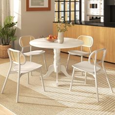 a white table and chairs in a room