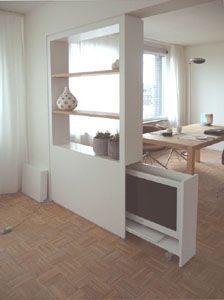 an empty living room with white walls and wood floors