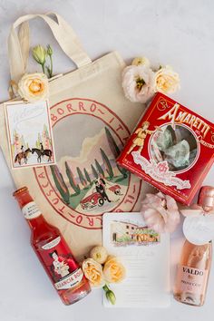 an assortment of perfumes and gifts laid out on a table