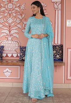 Readymade Faux Georgette Pakistani Suit in Sky Blue. This attire with Poly Shantoon Lining is Enhanced with Tassels, Pocket, Resham and Sequin Work. Crafted in Round Neck and Full Sleeve. Available with a Faux Georgette Palazzo and a Faux Georgette Dupatta in Sky Blue. The Kameez and Bottom Length is 56 and 38 inches respectively.              We sell all kinds of Salwar Kameez sets for Women Georgette Pakistani Suit | Georgette Salwar Kameez | Art Silk Salwar Kameez | Georgette Dupatta | George Blue Sequined Sets For Festive Occasions, Traditional Blue Sequined Sets, Light Blue Floral Embroidery Sets For Eid, Blue Sequined Sets For Eid, Blue Sequined Sets For Festivals, Blue Floor-length Sequined Anarkali Set, Blue Sequined Sets For Wedding, Blue Sequined Wedding Set, Light Blue Floor-length Sets With Resham Embroidery