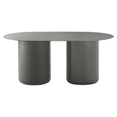 an oval table with two round bases